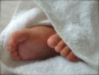 baby feet in towel
